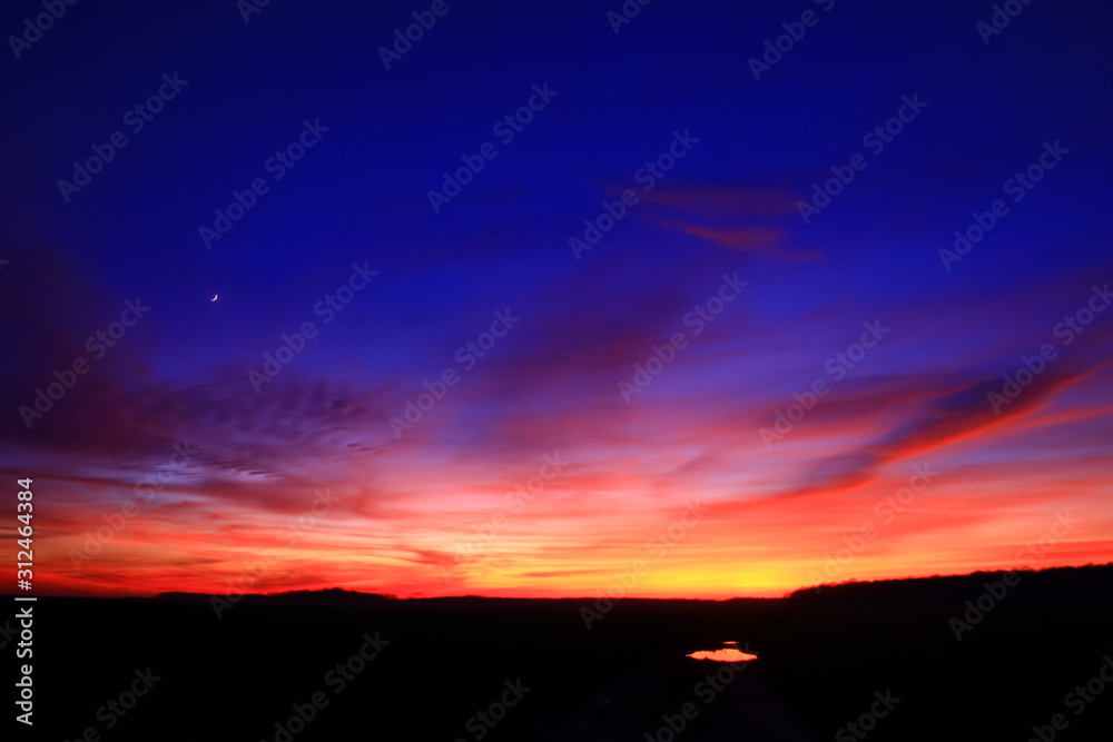 Very colorful clouds in dramatic sky. Romantic sunset at the countryside. Very colorful clouds in dramatic sky. Romantic sunset at the countryside.