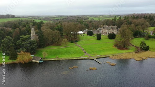 Castle Leslie, Glaslough, Monaghan, Ireland, Drone flying high revealing lake and estate photo