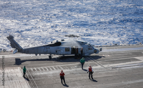 USS Ronald Reagan operates off the coast of Rockhampton, Australia during Exercise Talisman Sabre.  A MH-60 Seahawk prepares to take off