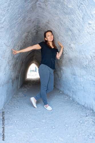 girl in a tunnel with dramatic light