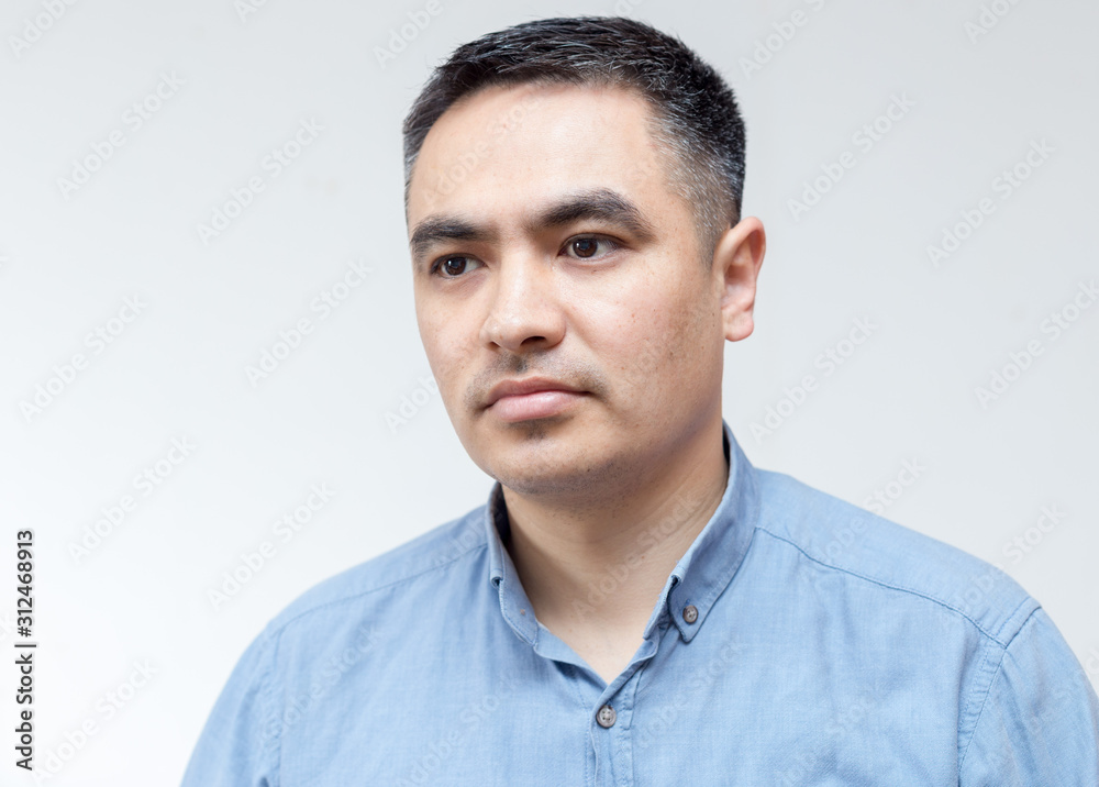 Fototapeta premium Attractive handsome smiling positive happy business man. Closeup portrait of a polite middle age man wearing a blue shirt