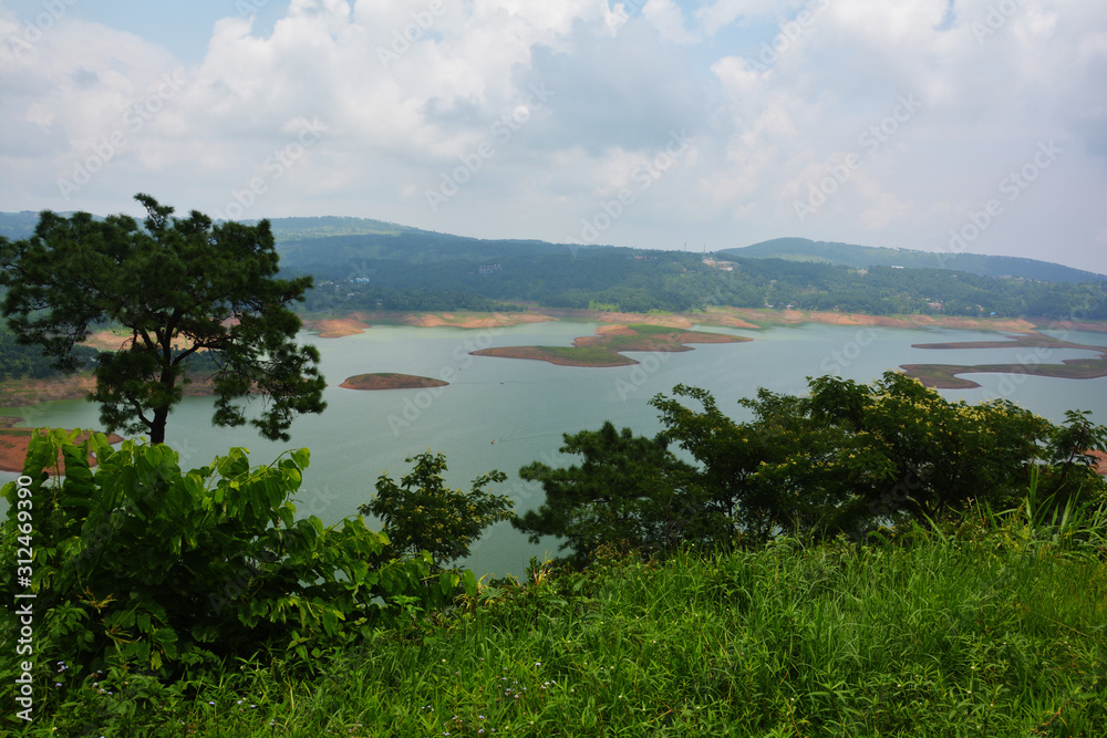 Barapani or Umiam Lake of  Shillong, Meghalaya as seen fron the view point on the road with water, trees and natural beauty, selective focusing