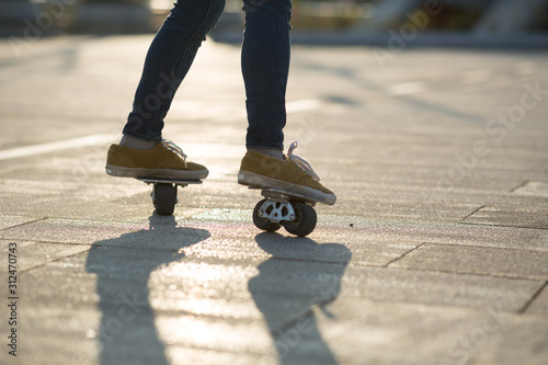 Freeline skateboarder legs skateboarding at city © lzf