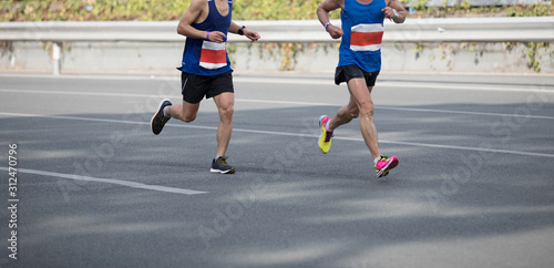 Marathon runners running on the race on city road