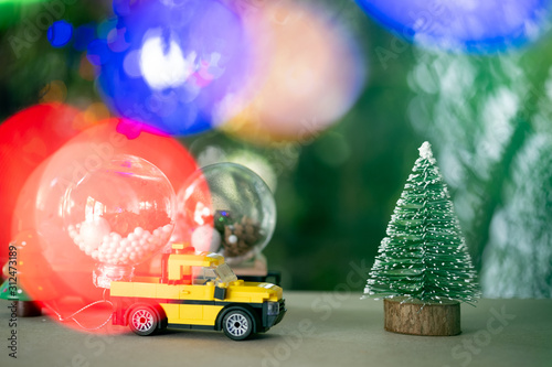 Pickup truck delivery of Christmas ball for decoration on Christmas tree. Preparing for the New Year holidays.
