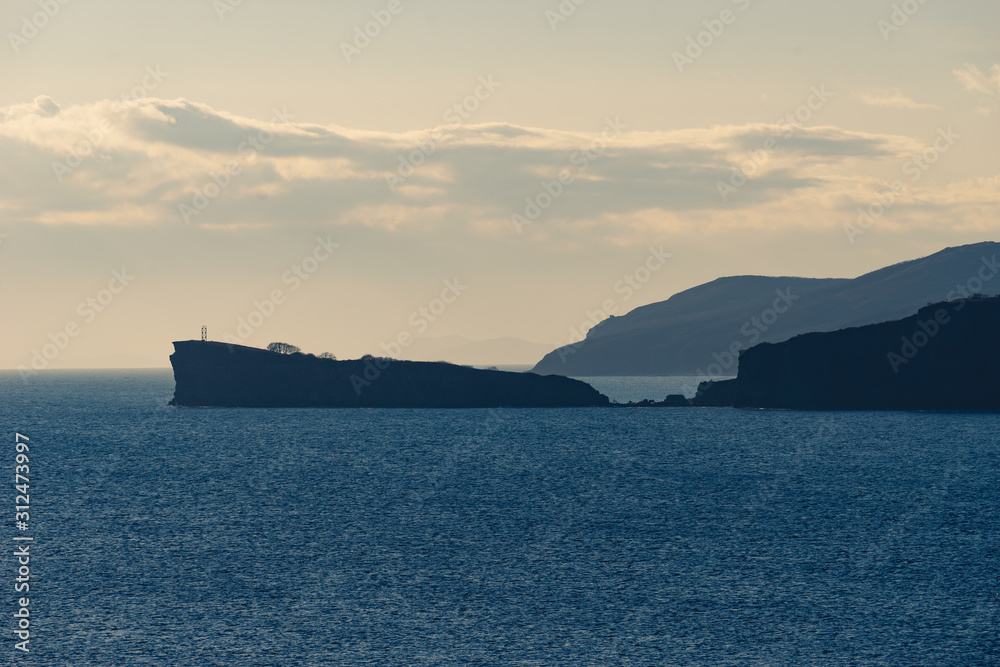 Natural landscape with the silhouette of the Cape Tomisina