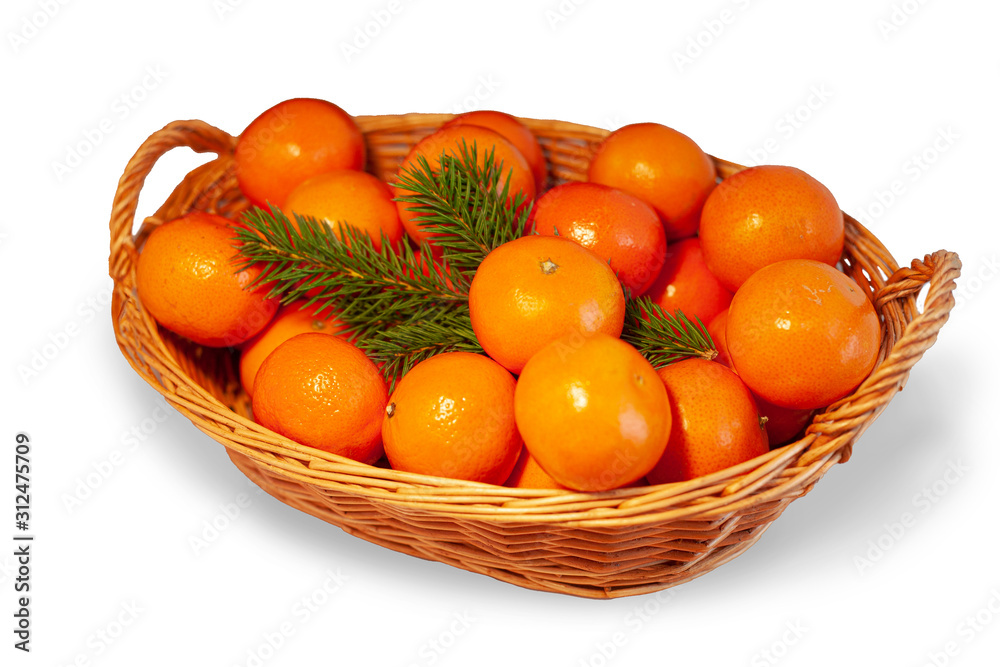 Tangerines with cinnamon in a basket isolated with shadow Tangerines with cinnamon in a basket isolated with shadow