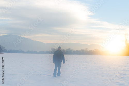 portrait of a man on the background of a snowy field