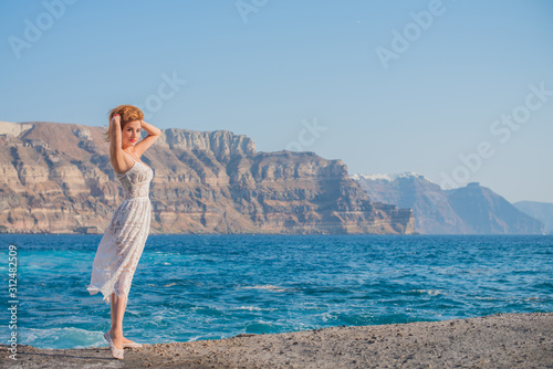 Trip on a Santorini, vacation concept, pretty woman rest in Greece 