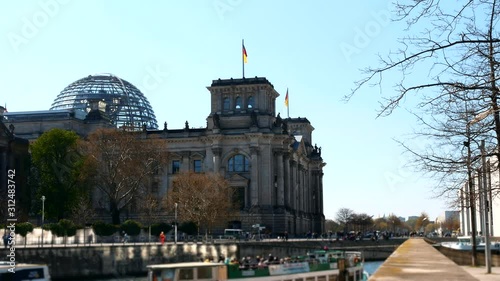 Reichstag (Deutscher Bundestag). Famous Reichstag building, seat of the German Parliament . Central Berlin Mitte district.  photo