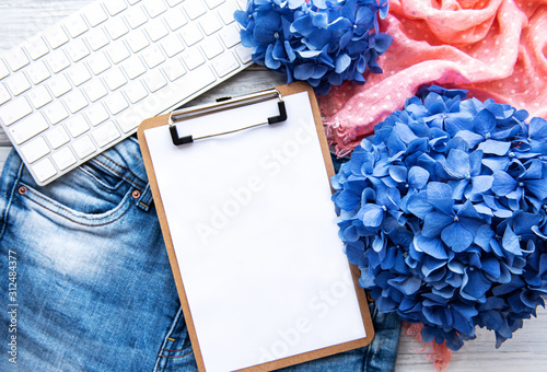 Blank clopboard with flowers photo