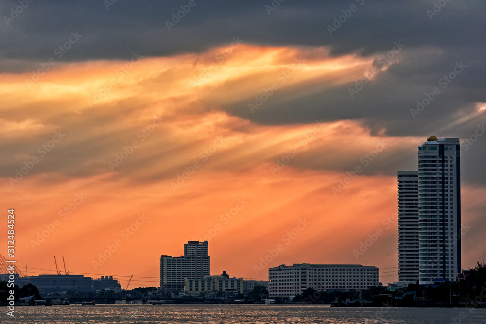 ray of light pass building near the river