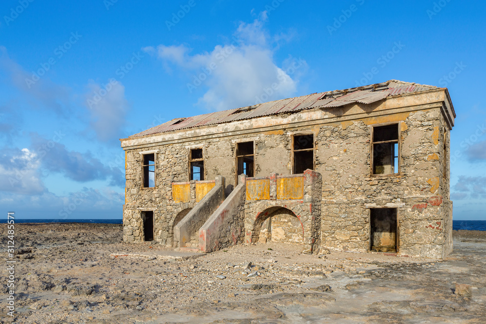 Old historic hotel building as ruin near sea