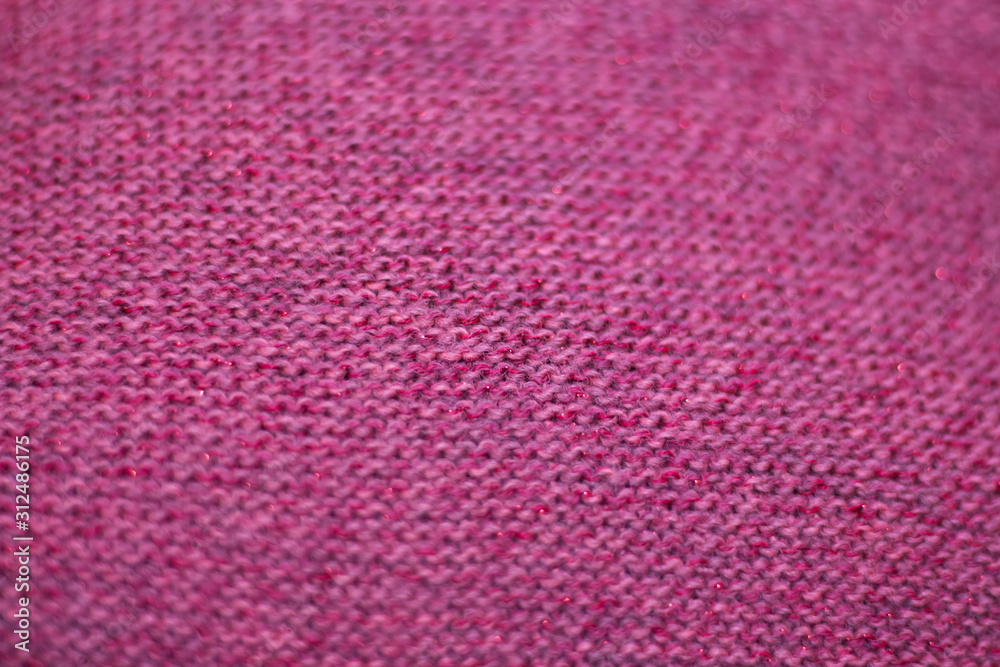 texture of pink wool knitted fabric as background