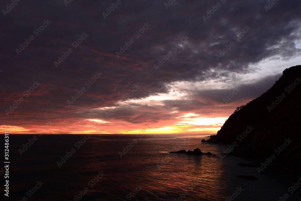 Dramatic sunset on the coast. Moneglia. Liguria. Italy