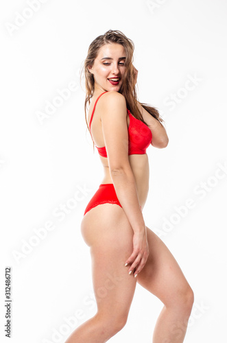 Beautiful, sexy, elegant blonde woman in red lingerie on a white background