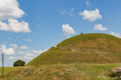KRAKOW, POLAND - MAY, 12, 2018: View at Krakus mound (Kopiec Kraka) with people on it. photo