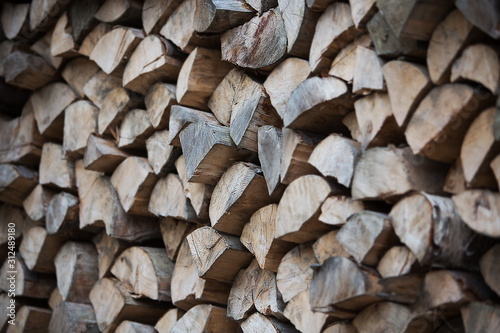 natural background from a pile of wooden logs