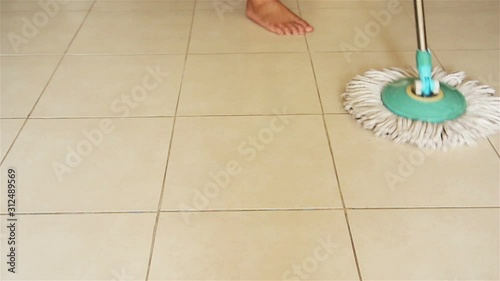 Mopping Ceramic Floor with Mop
