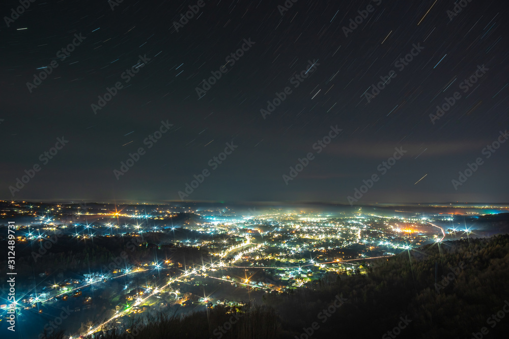 View of the night Ukrainian city in the fog