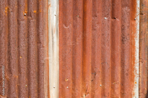 Surface of the red rusted zinc plate closeup.