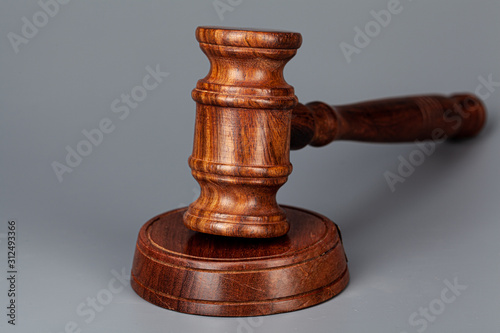 Wooden judges gavel on table close up