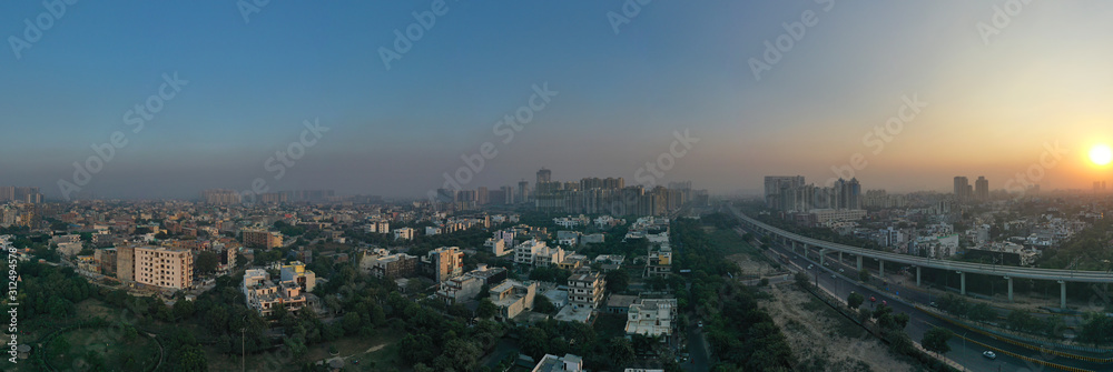 Coronavirus, Covid-19, lock down situation in delhi, india, Panoramic aerial view of Noida,gurgaon, india, Rapid metro tracks in urban areas of Delhi NCR. Cityscape.. sars-cov-2