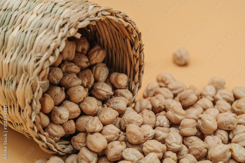 Healthy organic dried chickpeas in a straw basket Healthy organic dried chickpeas in a straw basket