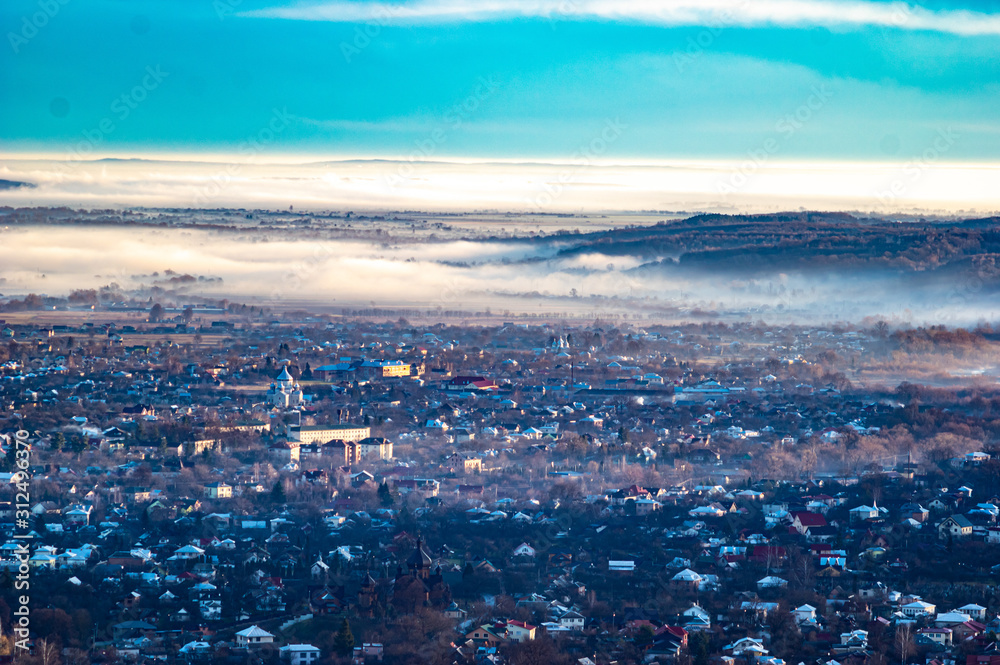Morning city in the fog
