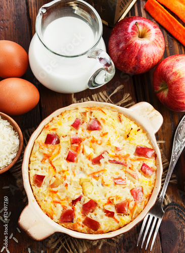 Rice casserole with apples and carrots photo