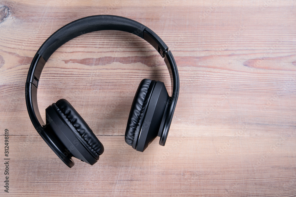 Wireless Headphones. Music, video, online courses, podcasts and entertainment concept Wireless Headphones. Music, video, online courses, podcasts and entertainment concept