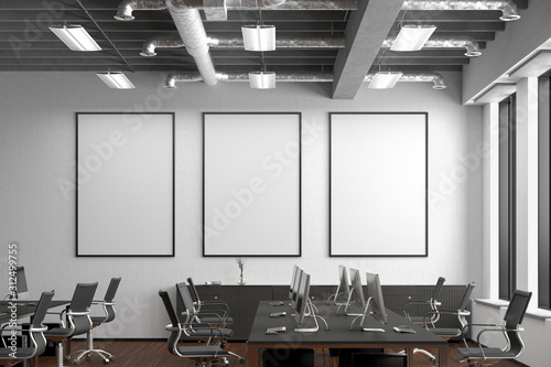 Obraz na plátně Three blank vertical posters mock up on the white wall in office interior