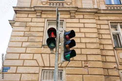Red traffic light against building; Prague; Czech Republic