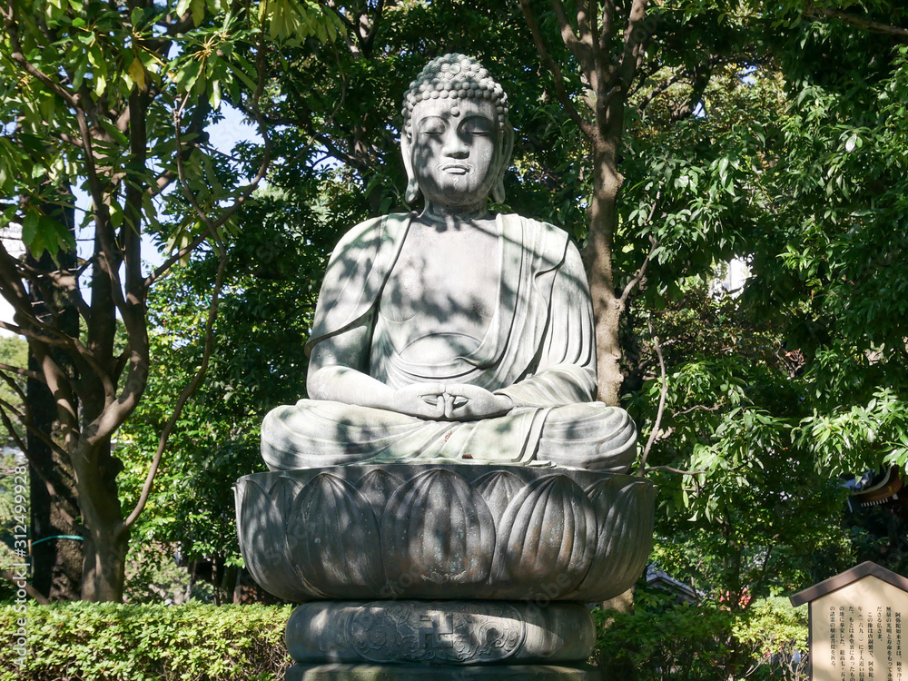 statue in garden sensoji tokyo japan
