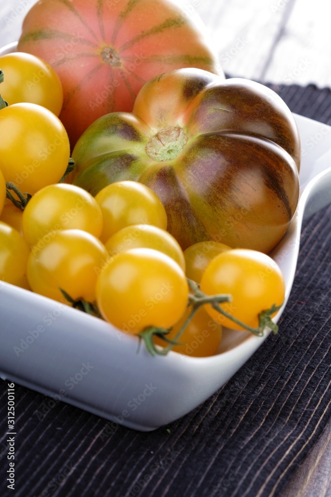 Studio shot of tomatos in dish