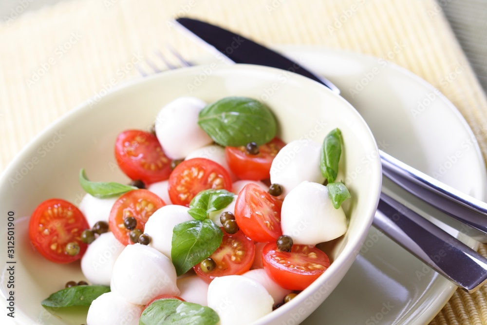 Close of tomato and mozarella in dish Close of tomato and mozarella in dish
