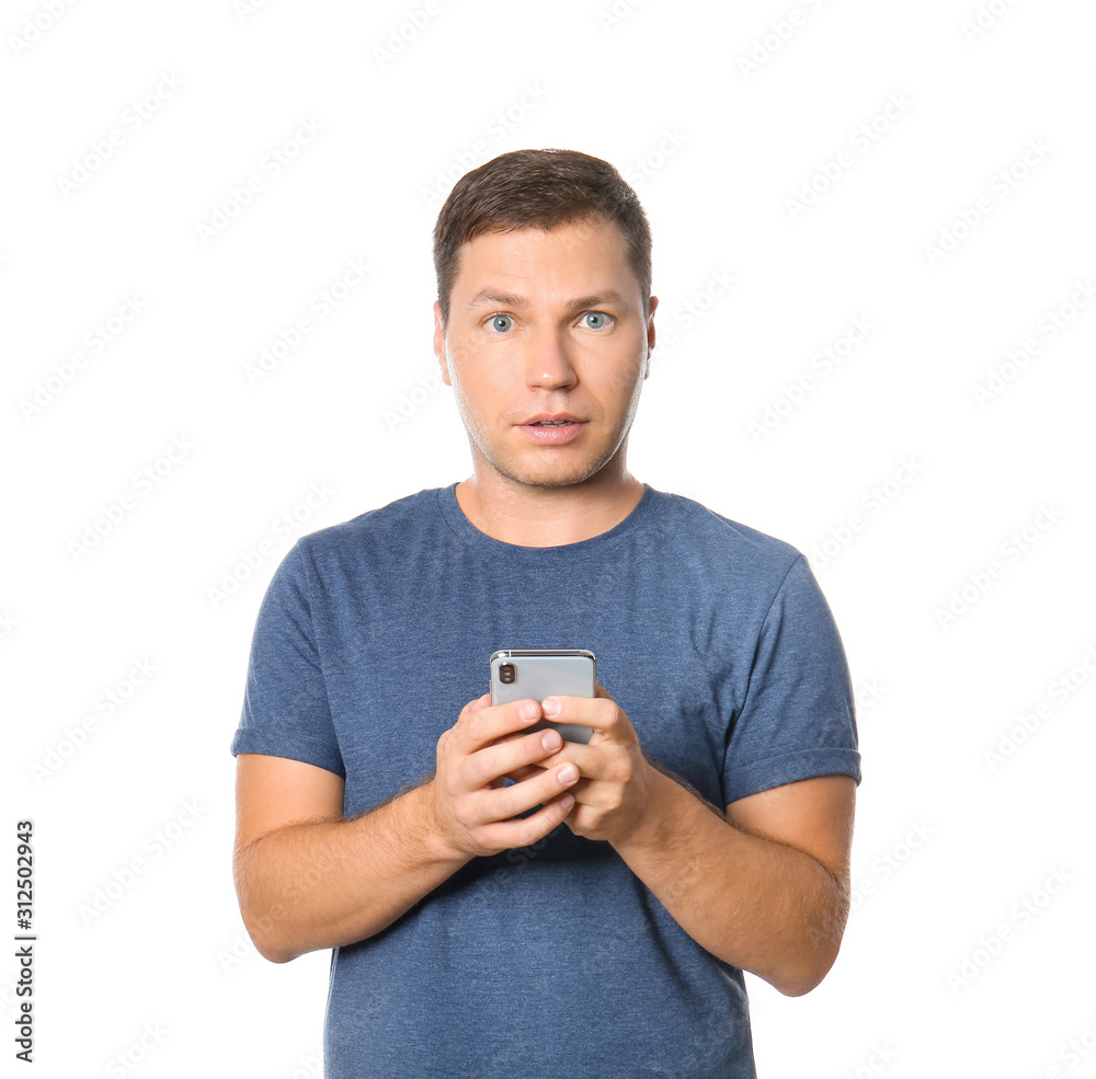 Portrait of surprised man with mobile phone on white background Portrait of surprised man with mobile phone on white background