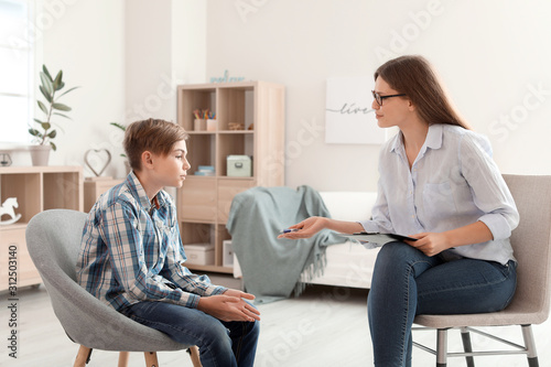 Female psychologist working...