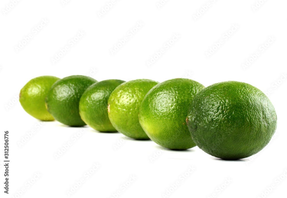 Limes on white background - studio shot Limes on white background - studio shot