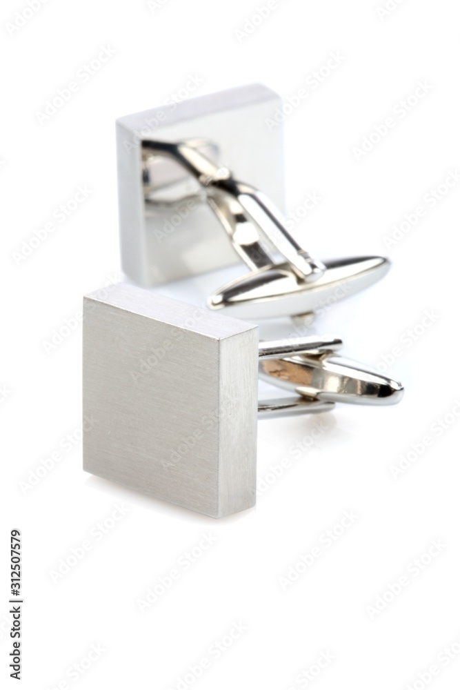 Silver cuff links on white background Silver cuff links on white background