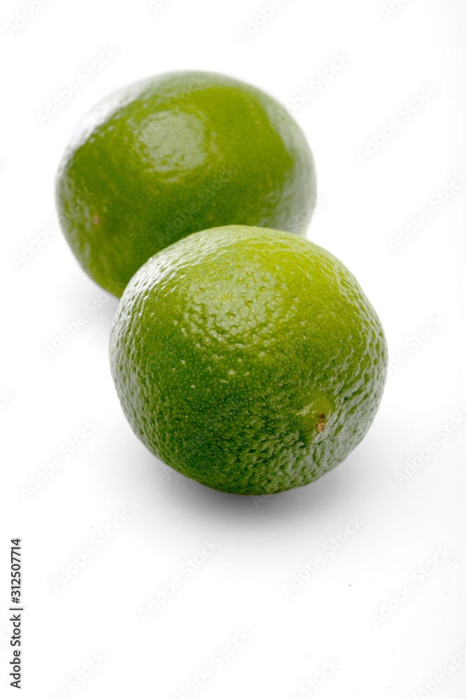 Limes on white background - close-up Limes on white background - close-up