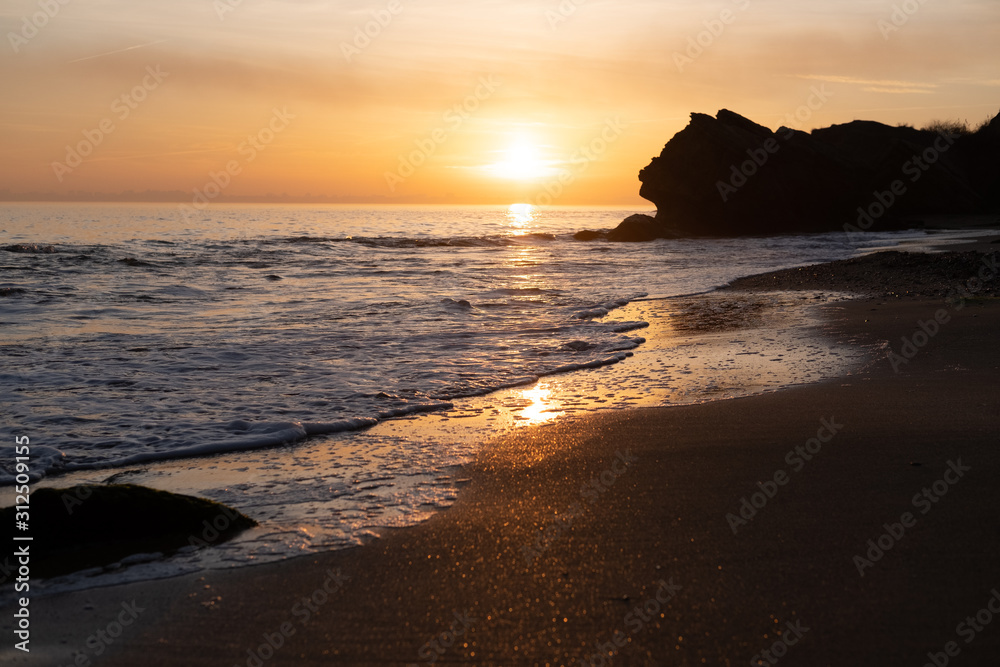 Beautiful landscape with sunset, cliffs and sea Beautiful landscape with sunset, cliffs and sea