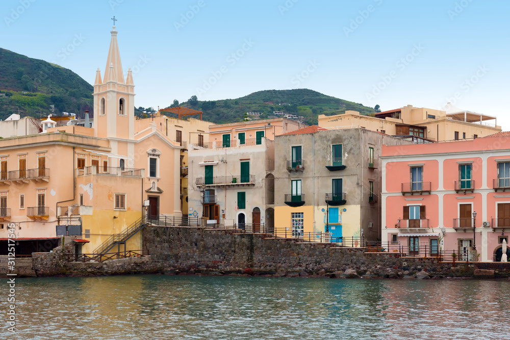 San Giuseppe church and multicolored houses in Lipari port, Aeolian islands, Italy