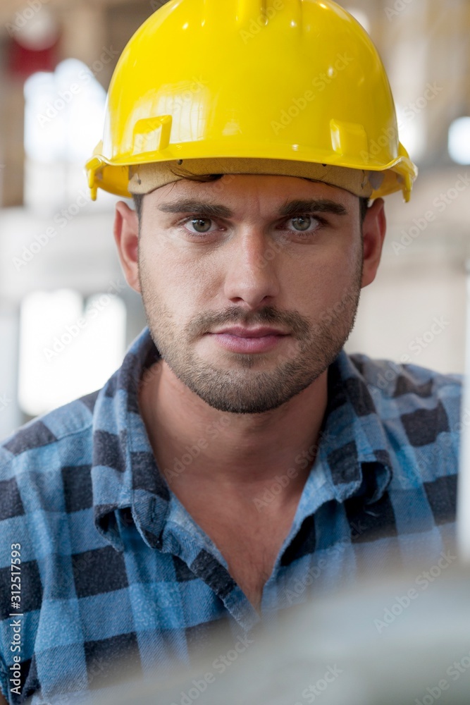 Portrait of confident young male worker in industry Portrait of confident young male worker in industry