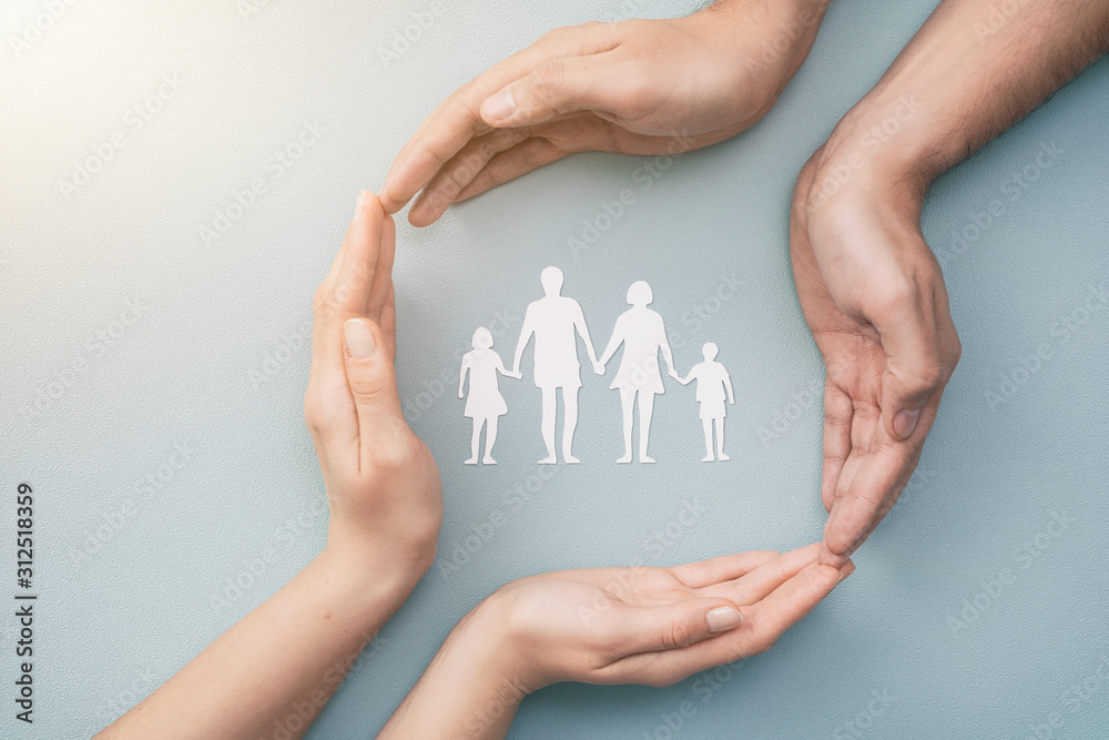 Family care concept. Hands with paper silhouette on table. - obrazy, fototapety, plakaty 