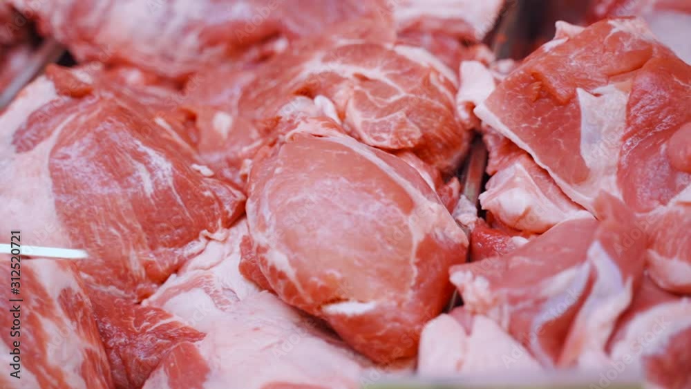 Showcase in the store. Meat pork. Close-up in retail. Showcase in the store. Meat pork. Close-up in retail.