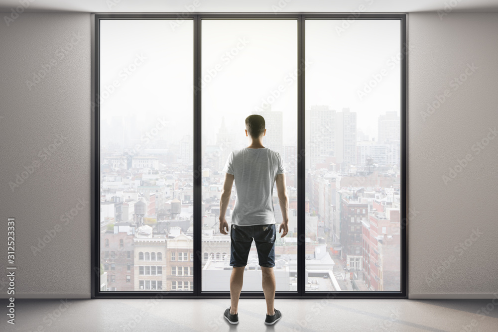 Fototapeta premium man in shorts standing in modern interior