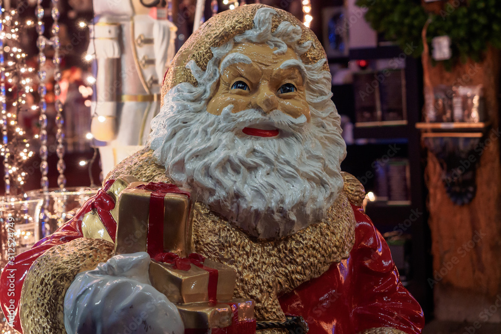 Santa Claus figurine with a gift
