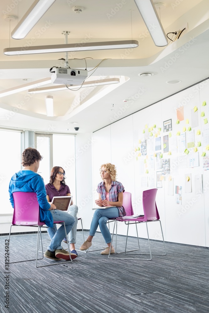 Businesspeople working at creative office space