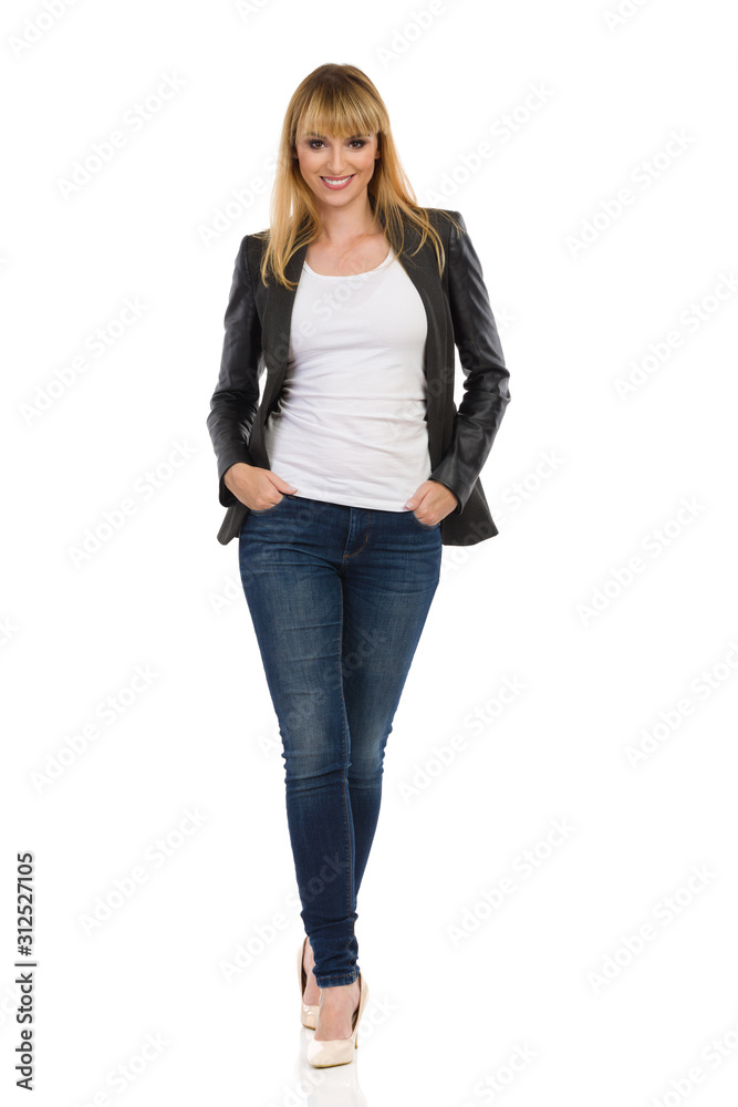 Confident Young Woman In Black Unbuttoned Tail Jacket Is Standing With Hands In Pocket. Front Veiw. Confident Young Woman In Black Unbuttoned Tail Jacket Is Standing With Hands In Pocket. Front Veiw.